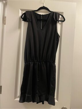 Black Sleeveless Ruffle-Hem Romper